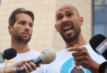 Online Empire Meets Handcuffs in Miami Two men speak into microphones during an outdoor press conference