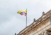 Jerusalem Gambit Jolts Latin America Colombian flag atop a neoclassical building