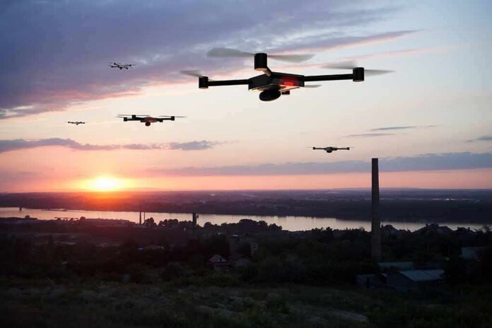 Drones flying over a river landscape at sunset