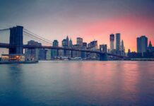 Brooklyn Bridge Chaos—Naked Plunge Sparks Uproar Brooklyn Bridge over East River at sunset with Manhattan skyline