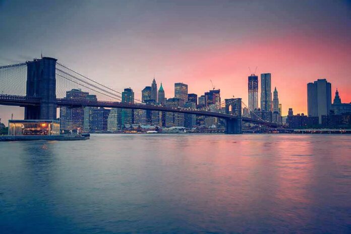 shutterstock_120154516 Brooklyn Bridge over East River at sunset with Manhattan skyline