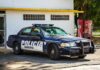 High-Level Cover-Up Alleged In Missing 43 students municipal police car parked by a building