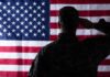 Soldier saluting the United States flag