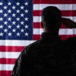 Soldier saluting the United States flag
