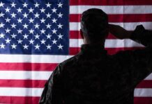 Soldier saluting the United States flag