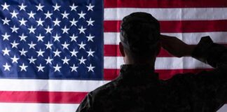 Soldier saluting the United States flag
