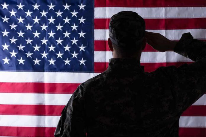 Soldier saluting the United States flag
