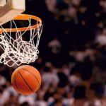 Basketball dropping through a hoop