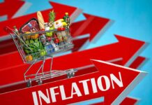 Paycheck Fragility Hits America Shopping cart full of groceries on red upward arrows labeled inflation