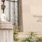 Department of Justice building facade with stone sign and window