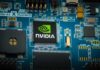 Robot Tax Brawl: Gates Clashes With Nvidia Nvidia chip on a blue circuit board