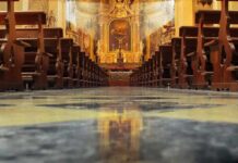 Quran Chant Shocks Catholic Mass Church interior with wooden pews facing ornate altar