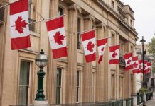 Prayer Ban Rocks Canada’s Military Canadian flags on a neoclassical building facade