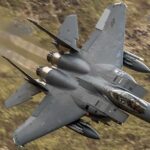Air Show Horror Leaves Unanswered Questions Fighter jet banking low over rugged terrain