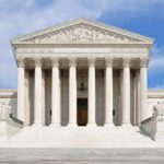 Runaway Law Showdown Hits Supreme Court Front view of the Supreme Court building with large columns and steps under a blue sky