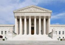 Runaway Law Showdown Hits Supreme Court Front view of the Supreme Court building with large columns and steps under a blue sky