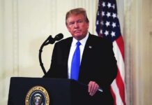 Price Whiplash Showdown Rocks Washington man at podium with microphone and US flag