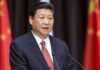 Xi Jinping speaking at a podium with microphones