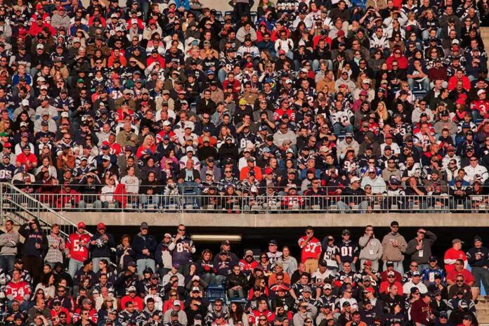 Peter Keys in a large stadium crowd of football fans