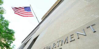 Department of Justice building with American flag
