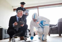 Forensic investigator collects evidence as police and detective observe