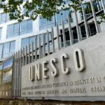 Exterior view of the UNESCO building with a prominent sign