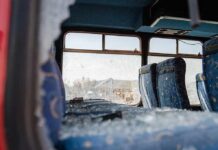 Terrifying MARTA Crash Caught On Camera Bus interior with shattered windows and blue patterned seats