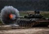 Tank firing main gun on training range