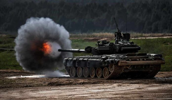 Tank firing main gun on training range