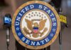 United States Senate seal at a podium