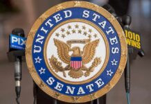 United States Senate seal at a podium
