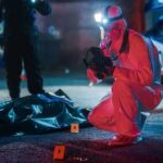 Freed, Then Chaos: Zurich Station Carnage forensic investigator photographs crime scene evidence at night