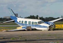 Runway Inferno After Alleged Booze-Fueled Flight Damaged blue and white small airplane on an airport runway