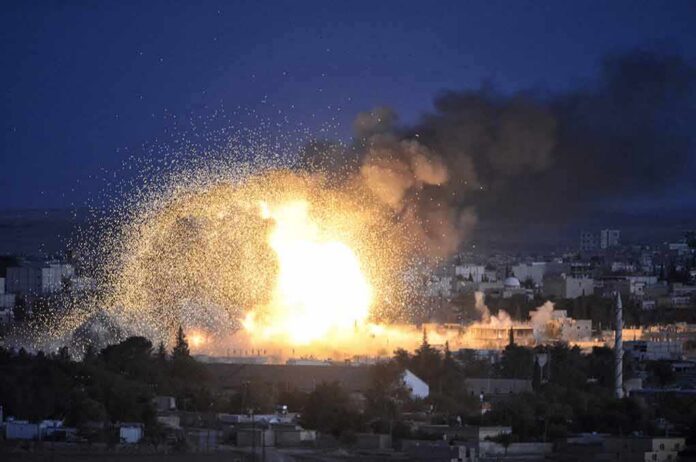 shutterstock_324859307 Large explosion over a city at night