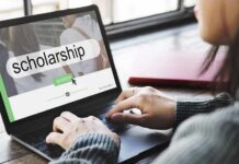 Person using a laptop to search for scholarships