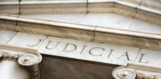 Courthouse facade with stone columns and entablature
