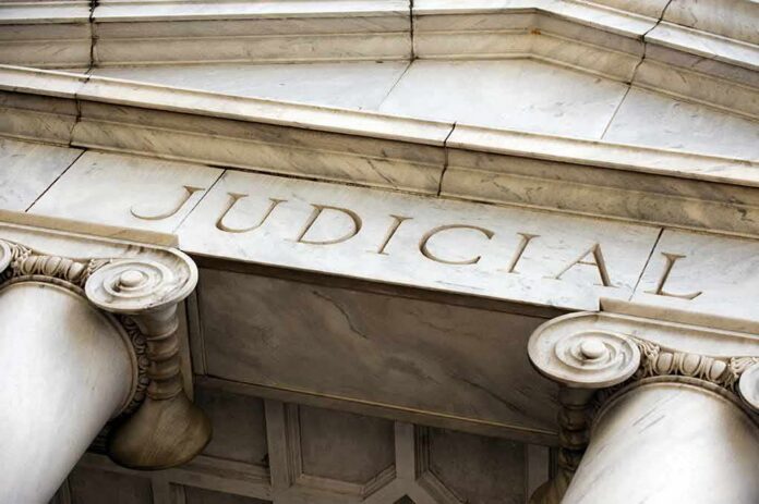 shutterstock_579394483 Courthouse facade with stone columns and entablature