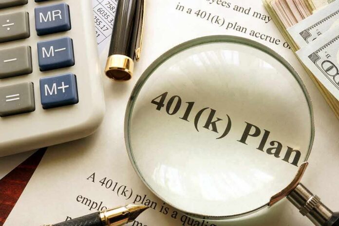 shutterstock_593390546 401(k) plan document under magnifying glass