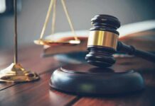Judge Smacks DOJ – Illegal Firing Exposed Judge's gavel on block with scales of justice