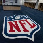 Paris Chaos, NFL Doubles Down NFL logo on the floor of an empty locker room
