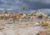 storm-damaged coastal neighborhood with demolished houses