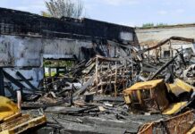 Burned building interior with collapsed charred debris