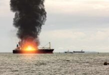Drone Strikes Rock EU Sea Lane Cargo ship on fire with thick black smoke at sea