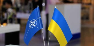 NATO and Ukraine table flags on a small metal stand