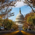Robotaxi Pushback: D.C. Power Fight United States Capitol dome framed by a tree-lined street