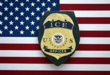 ICE Locator Policy Sparks Federal Lawsuit Over Transparency ICE officer badge on American flag background
