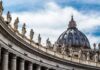 Vatican Power Merge Sparks Jitters St. Peter's Basilica dome with statues along colonnade