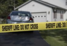 Florida Horror: Twins, Father Found Dead Sheriff line tape blocking a suburban driveway