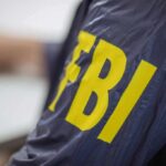 FBI jacket with large yellow letters